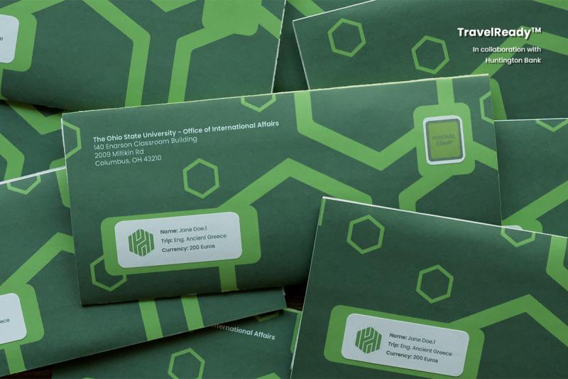 Close-up of several green TravelReady™ envelopes stacked in a pile