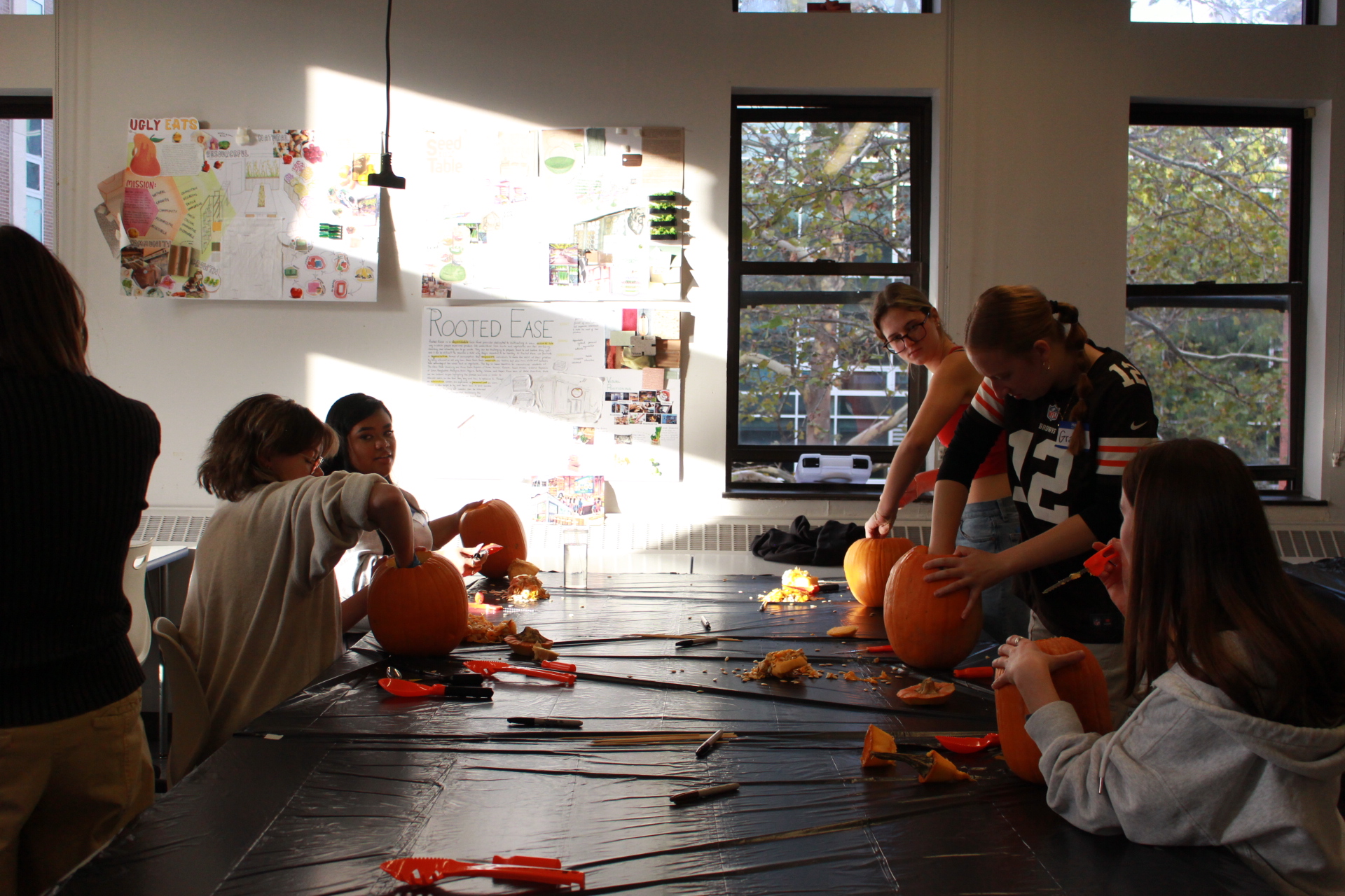 students gutting out pumpkins