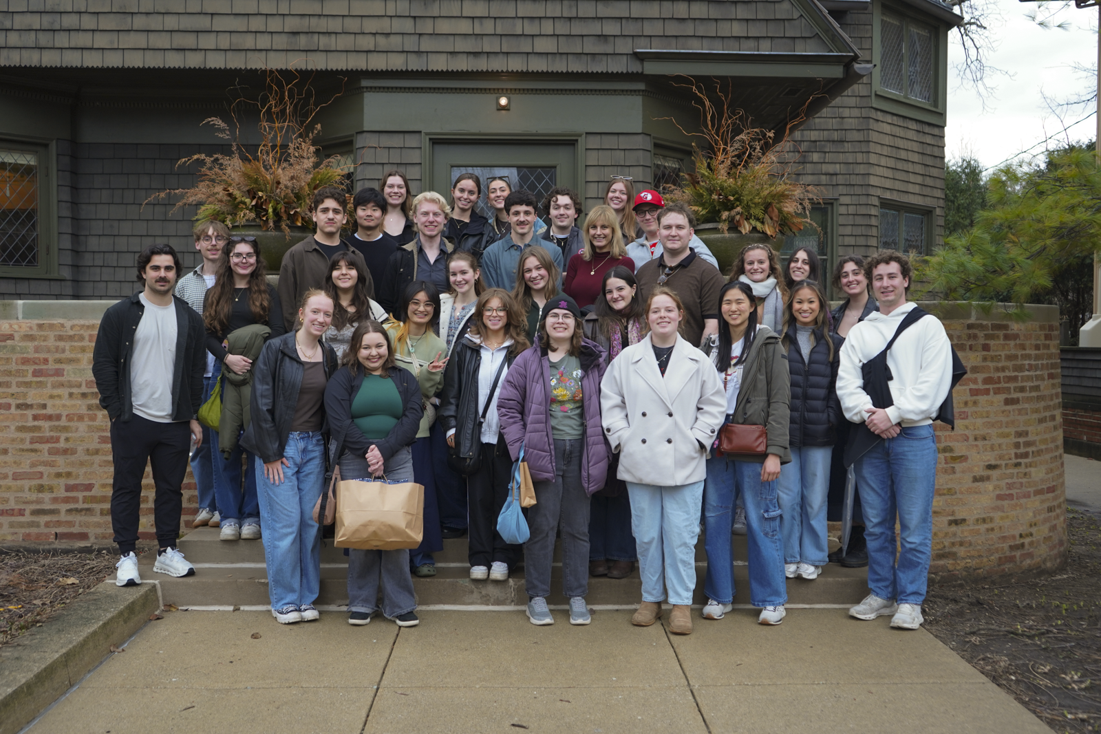 Students standing on stairs in front of the Frank Lloyd Wright Home and Studio 