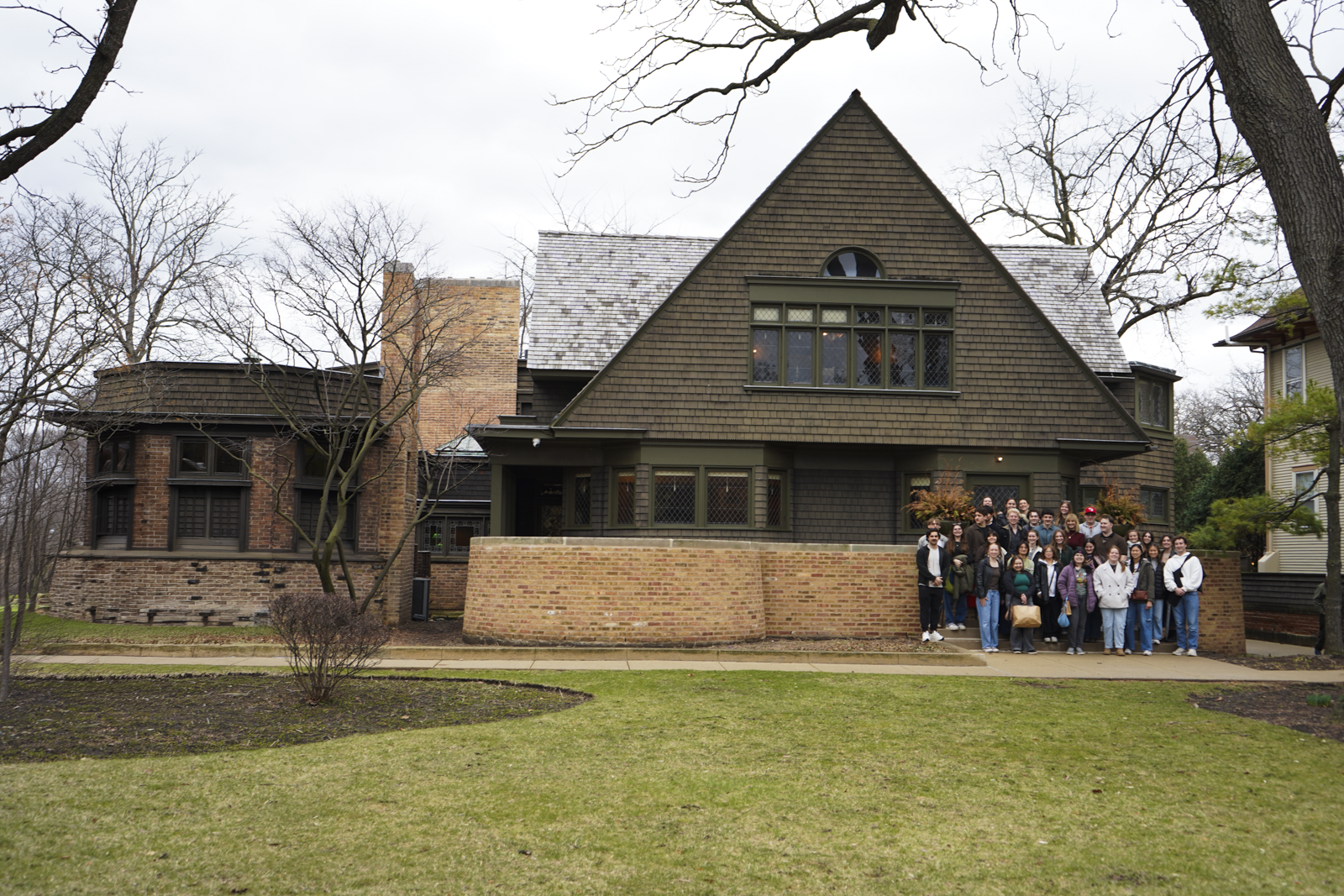 Students standing in the corner by the Frank Lloyd Wright Home and Studio 