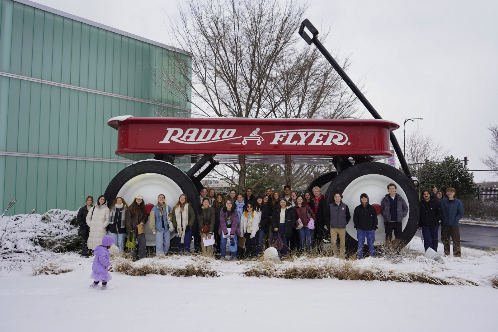 Students gathered underneath the biggest red wagon