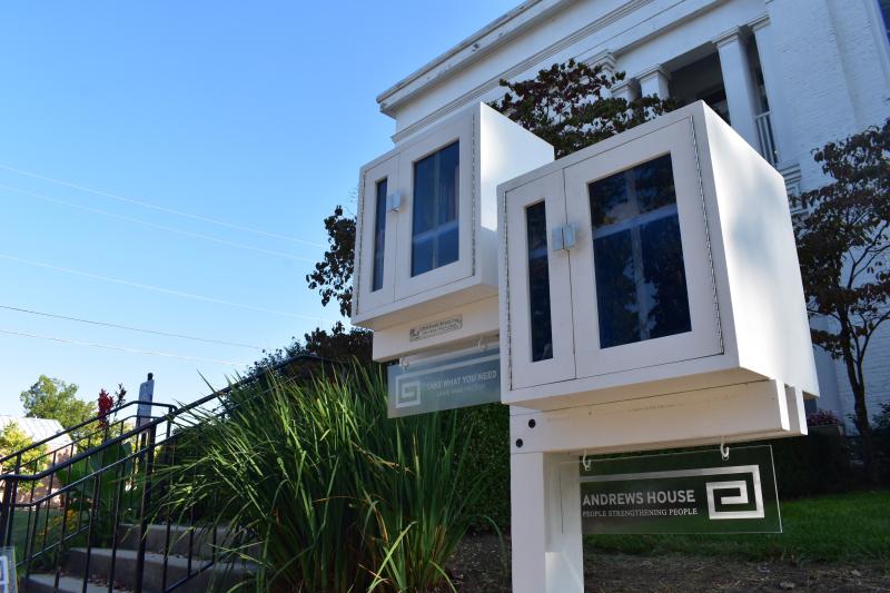 Worm's eye view of emergency food pantry and little free library exterior