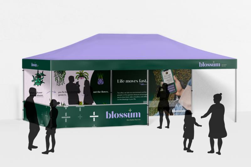 the blossum pop-up: a tent covered in the blossum logo and graphics 