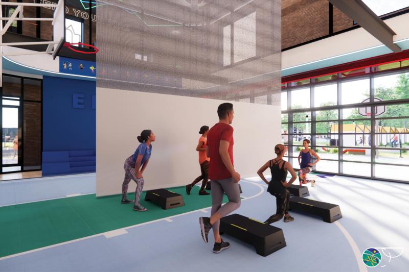 Multipurpose layout with divider curtain and exercise class happening on blue basketball court with folding garage door on back wall. 