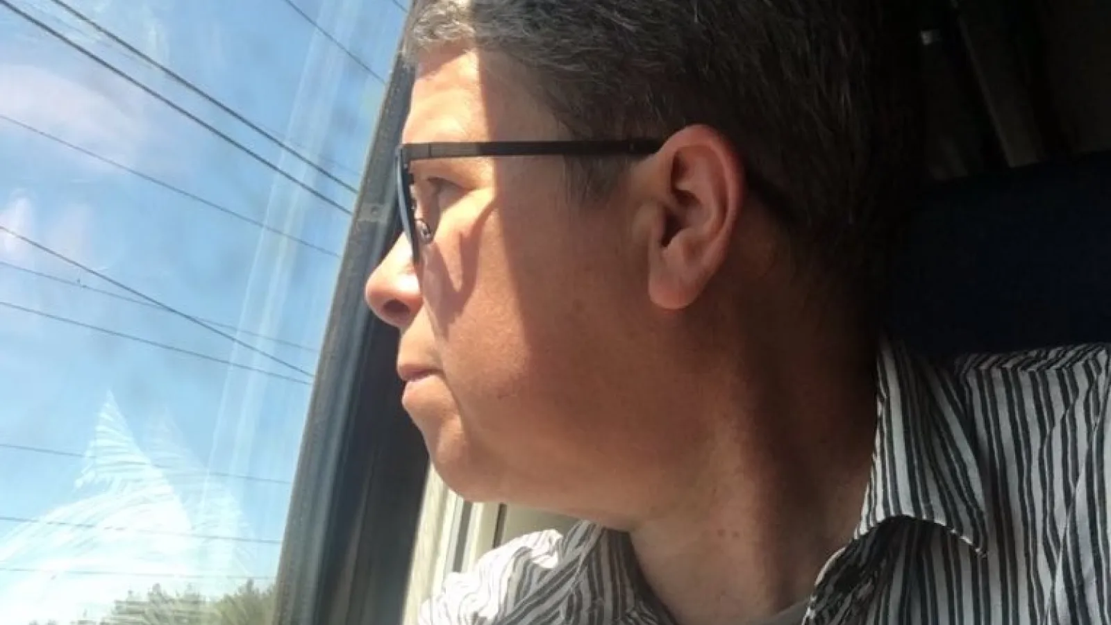 Mary Anne Beecher looking out a window, for opportunities!