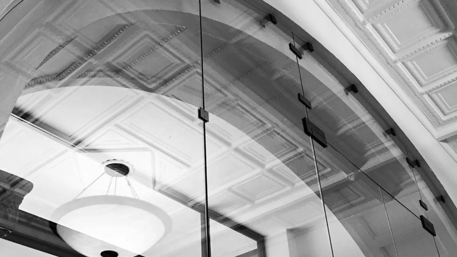 Black and White Photo of reflections in Hayes Lobby Entrance Glass