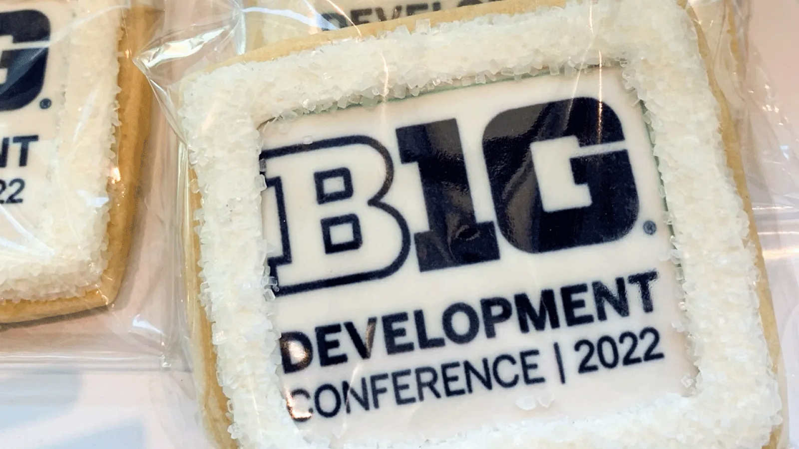 Close-up image of cookies on a table with icing that reads “BIG Ten Development Conference 2022”