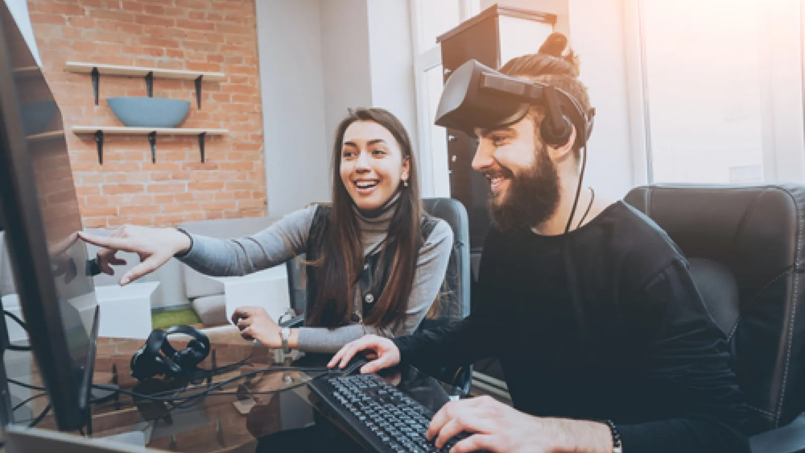 Two people testing video and AR/VR games.