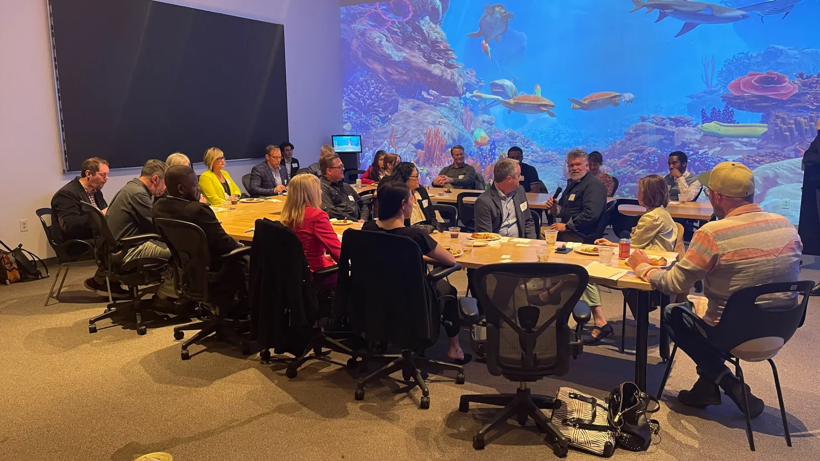 Discussion participants around conference table 