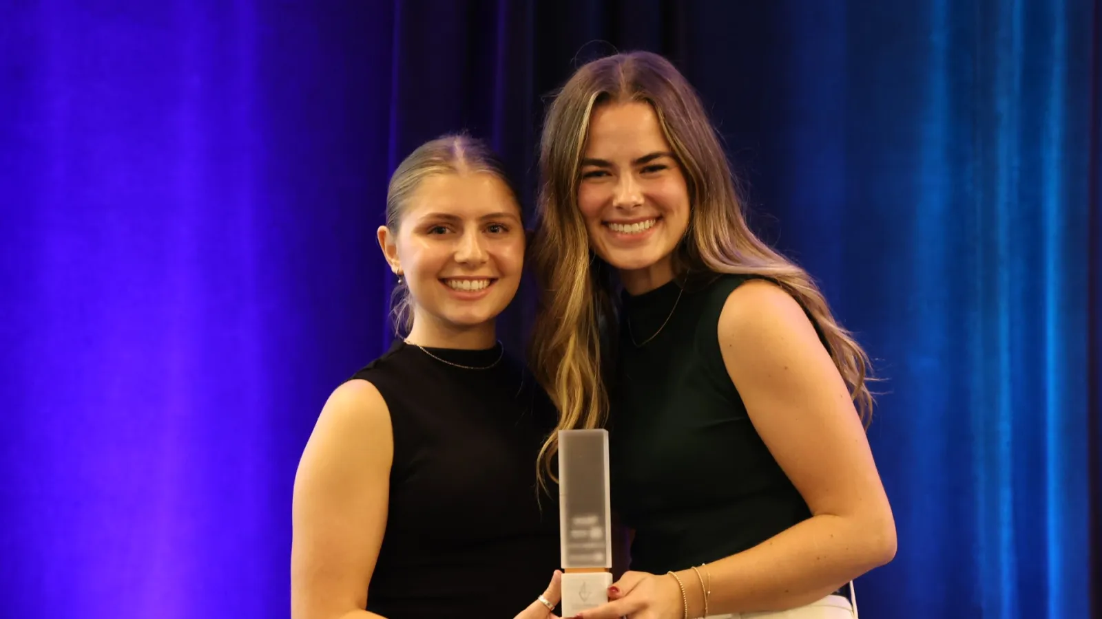 Brooke Koch and Averi Wolf accepting their IIDA Student Project of the Year Award.