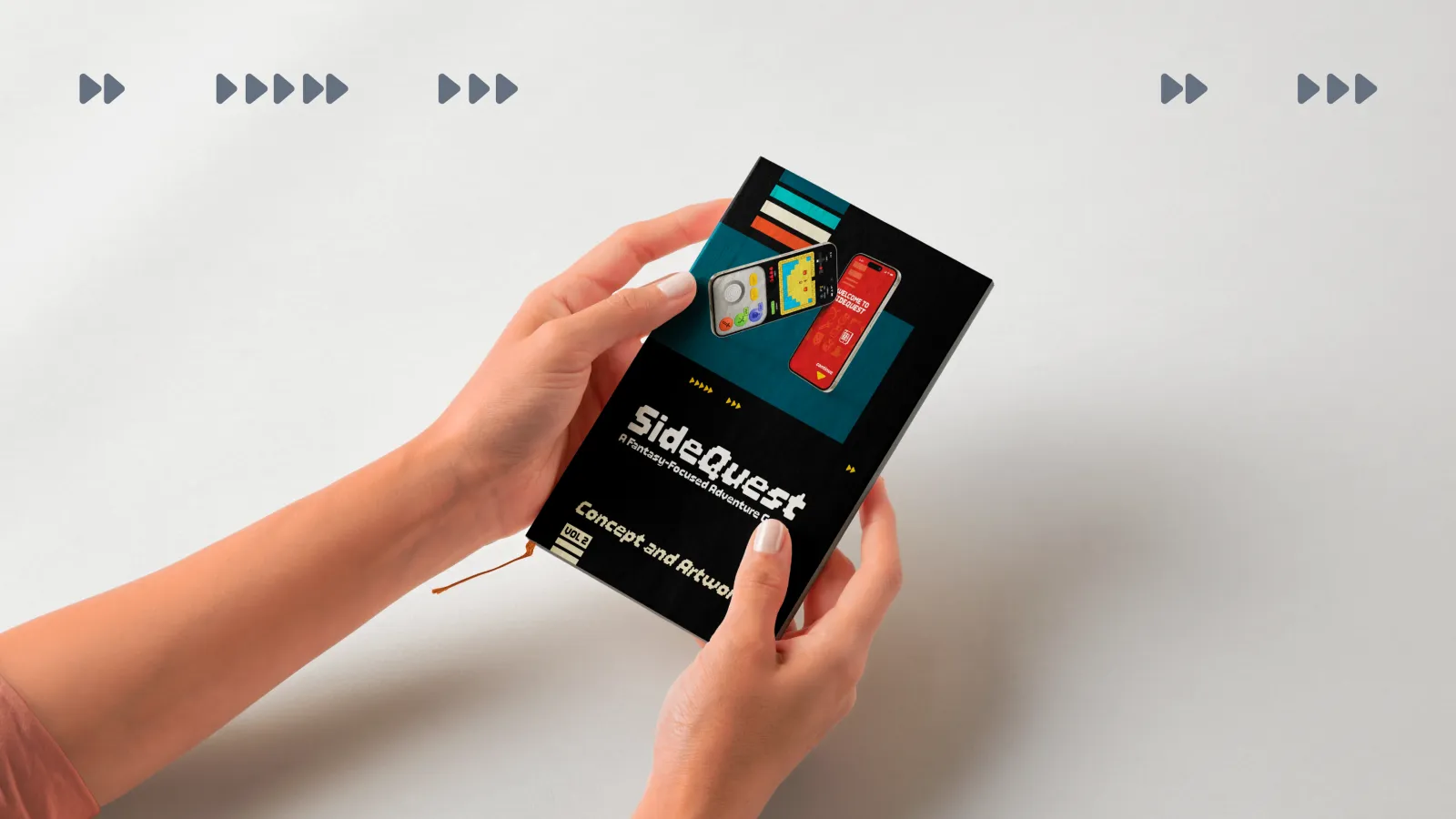 Hand holding a printed manual with SideQuest branding