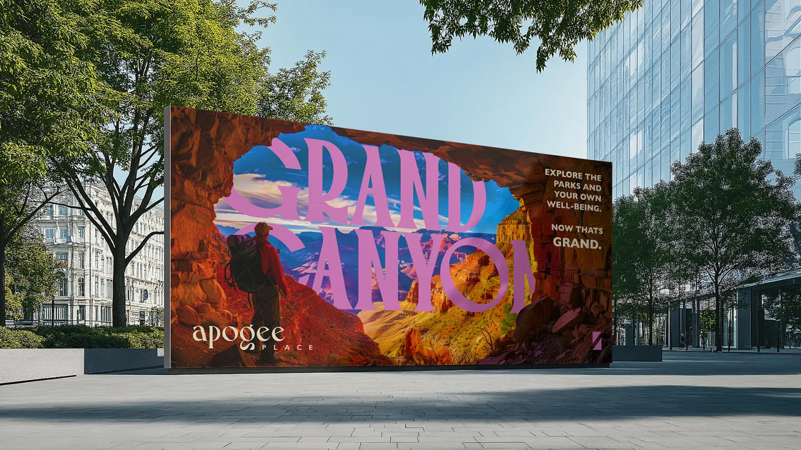 A billboard set in an urban area promoting Apogee Place at the Grand Canyon location 