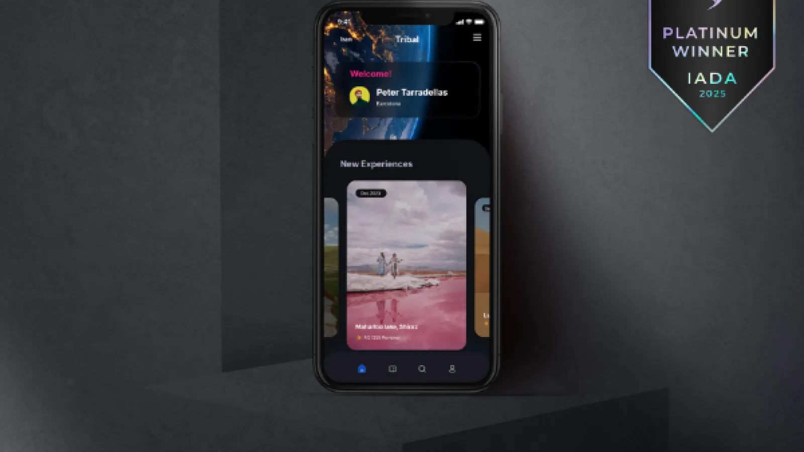 Phone screen shows Tribal travel app with a pink lake image