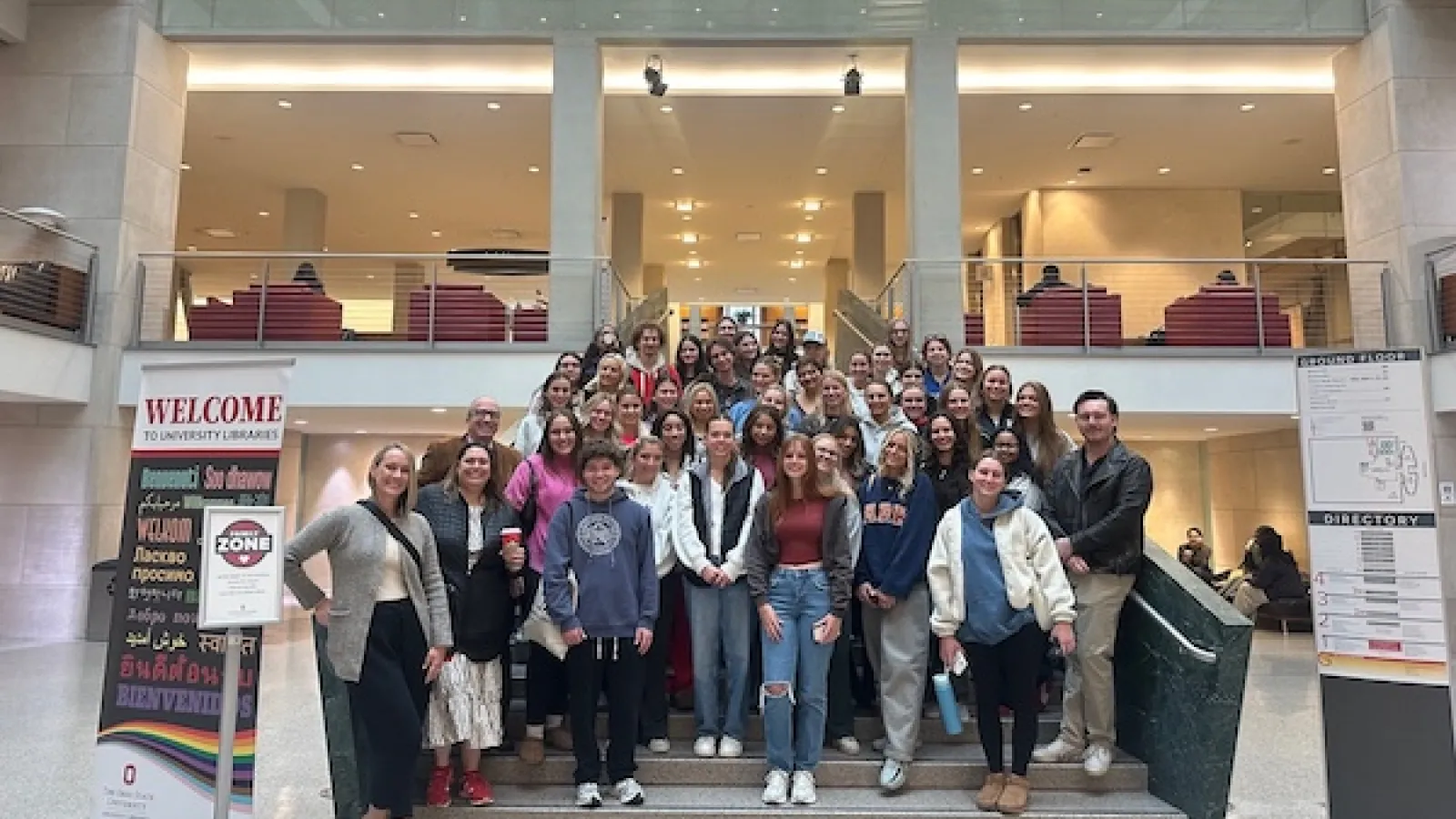 Group photo of participants standing on steps in Thompson Library