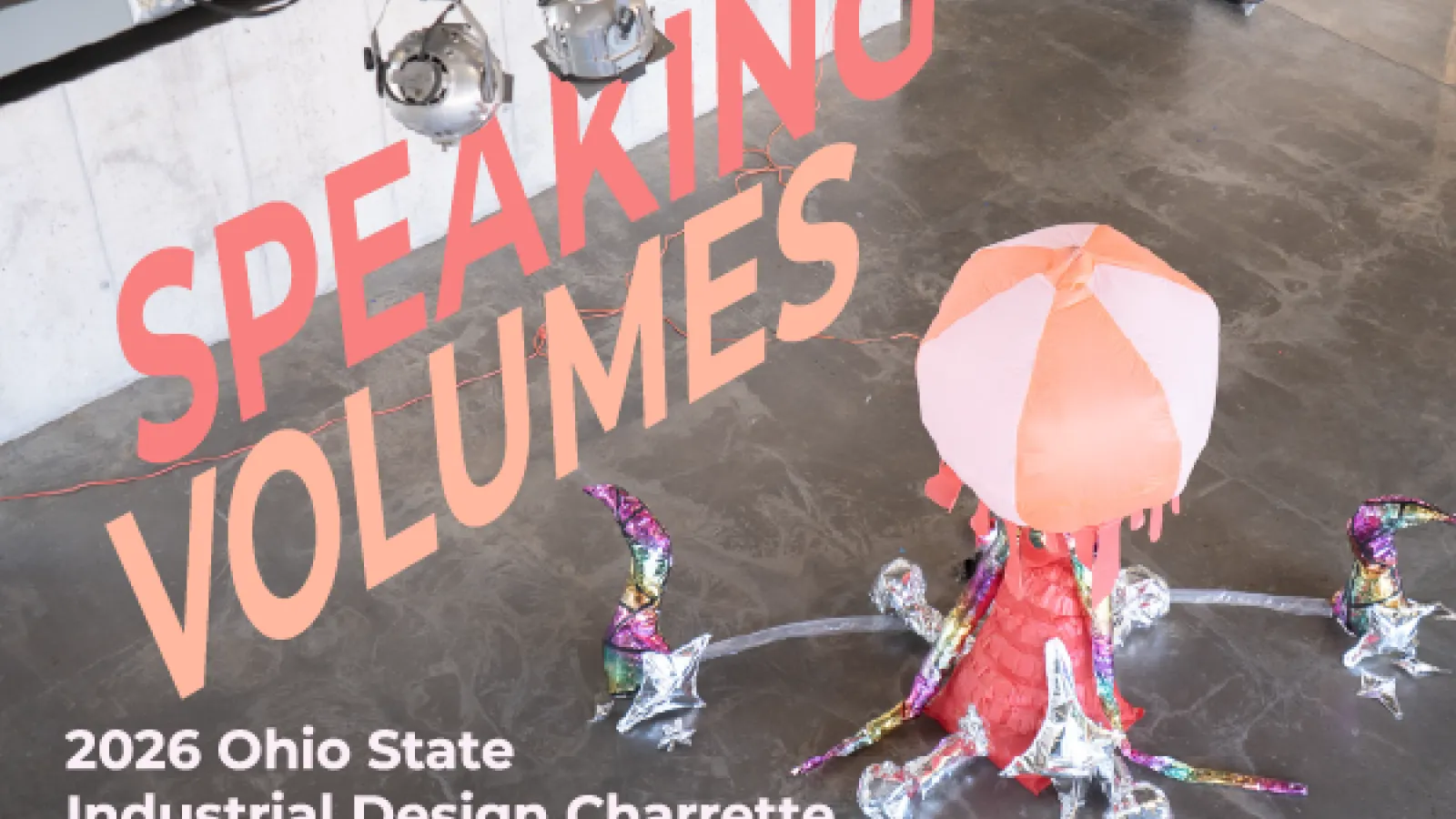 A large inflated object photographed in an open concrete space with words “SPEAKING VOLUMES” and “2026 Ohio State Industrial Design Charrette”. 