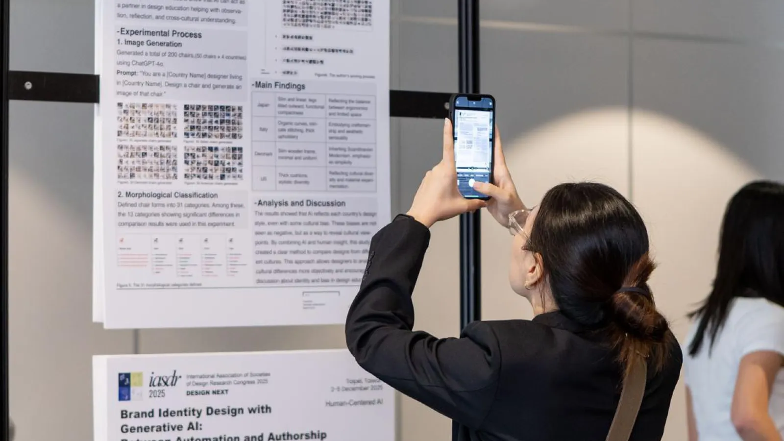 a conference participant interacting with the presenters' poster.