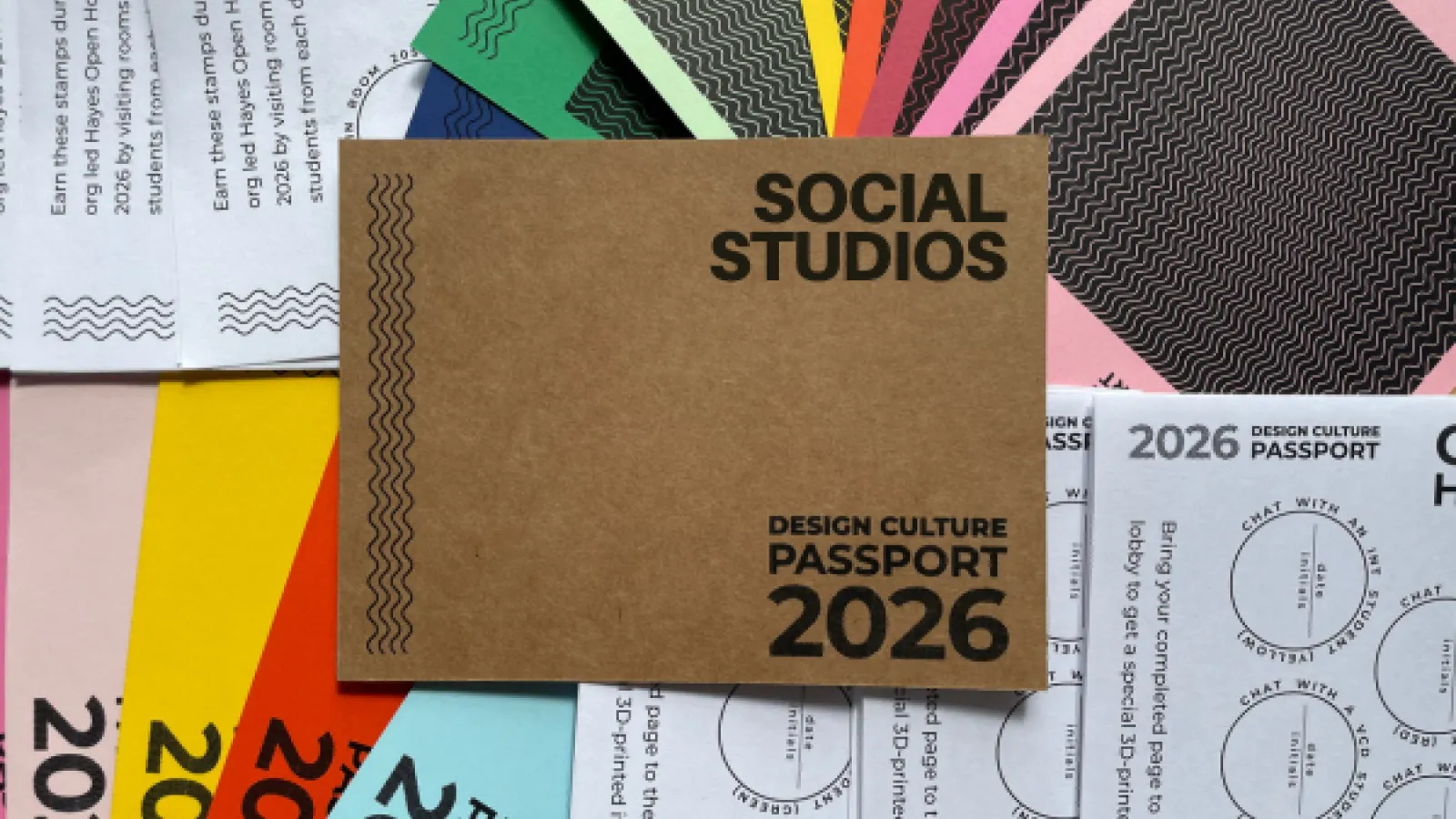 Colorful “Design Culture Passport 2026” booklets and stamp cards arranged