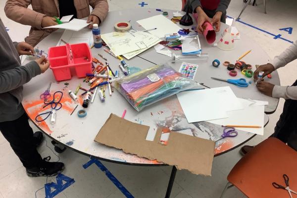 Image of children at table completing projects