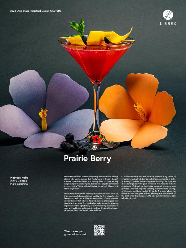 Photo of a pink mocktail drink garnished with fruit in a Libbey Vina Martini glass with paper flowers around it.