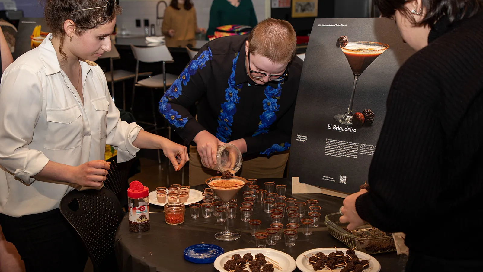 Two students prepare a mocktail drink.