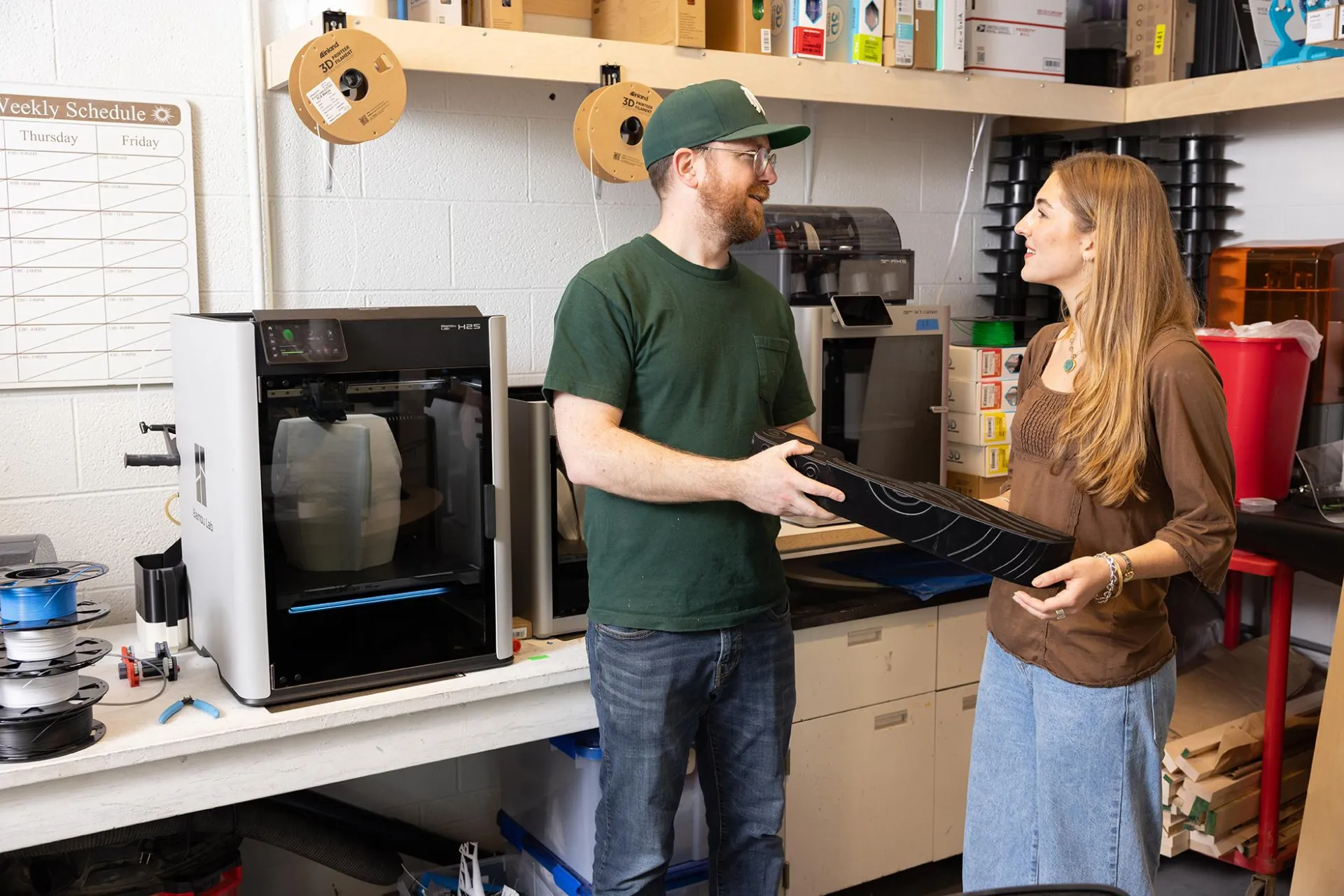 Francesca talk to digital fabrication lab supervisor Zach Sanderson.