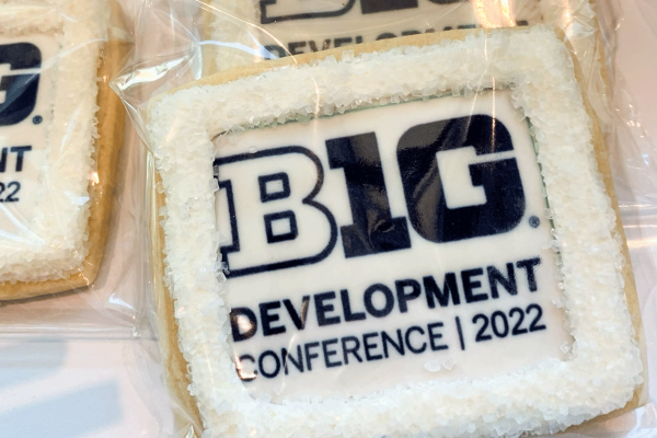 Close-up image of cookies on a table with icing that reads “BIG Ten Development Conference 2022”