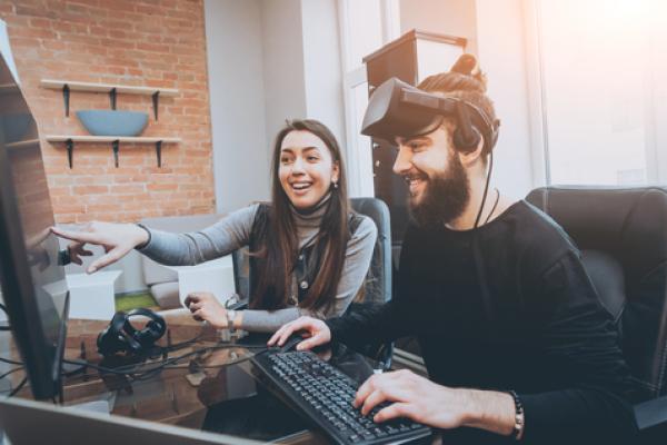 Two people testing video and AR/VR games.