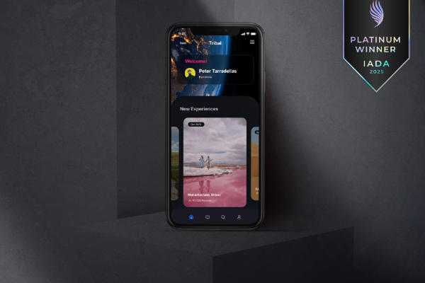 Phone screen shows Tribal travel app with a pink lake image