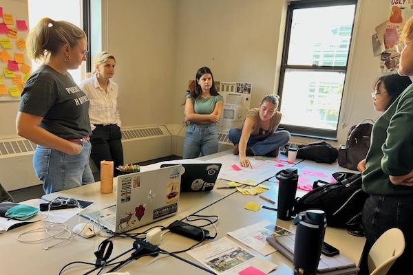 Professionals make the rounds to advise students on their designs.