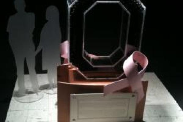 Block O Trophy with a pink breast cancer ribbon attached