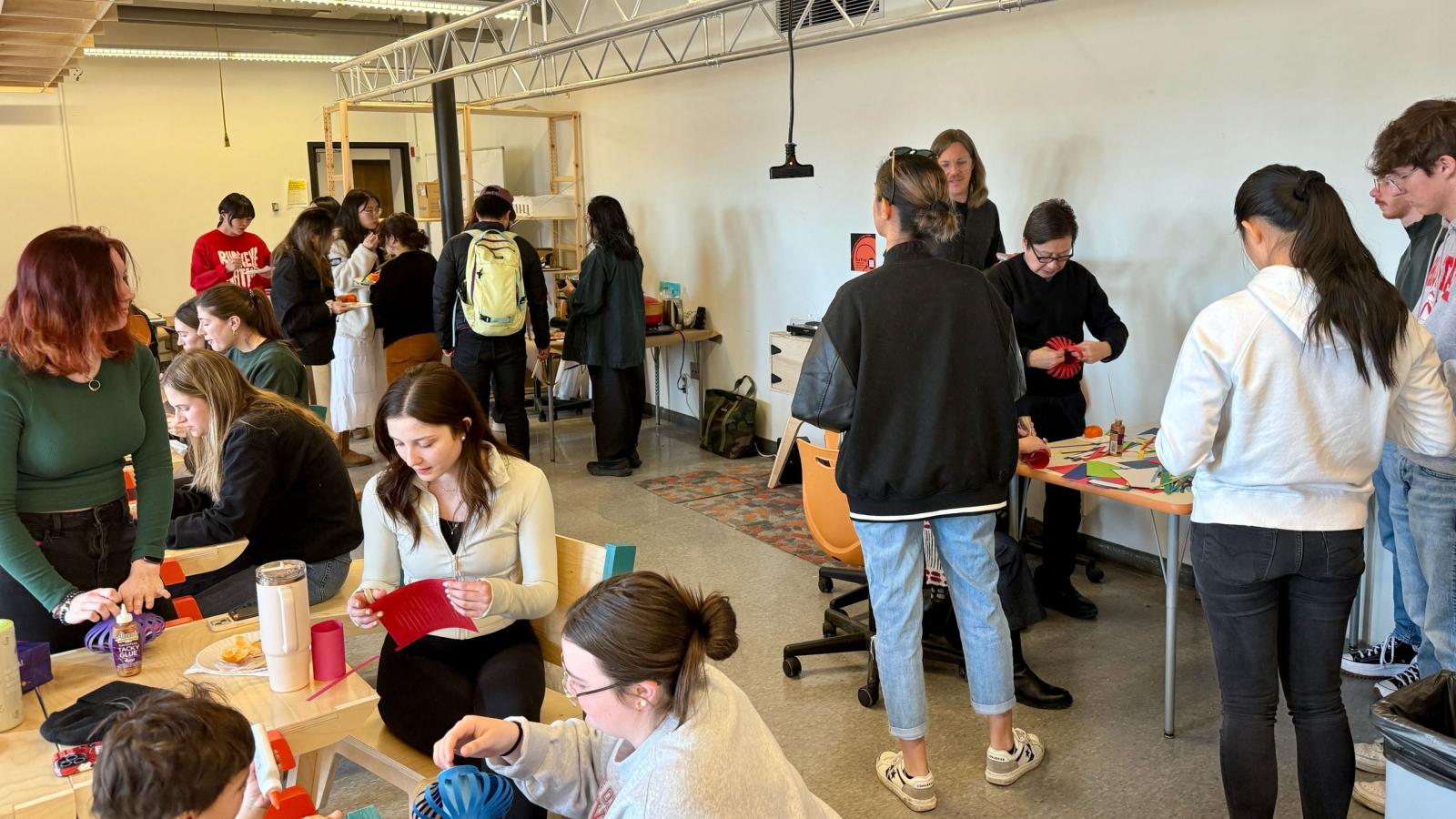 students and faculty socializing