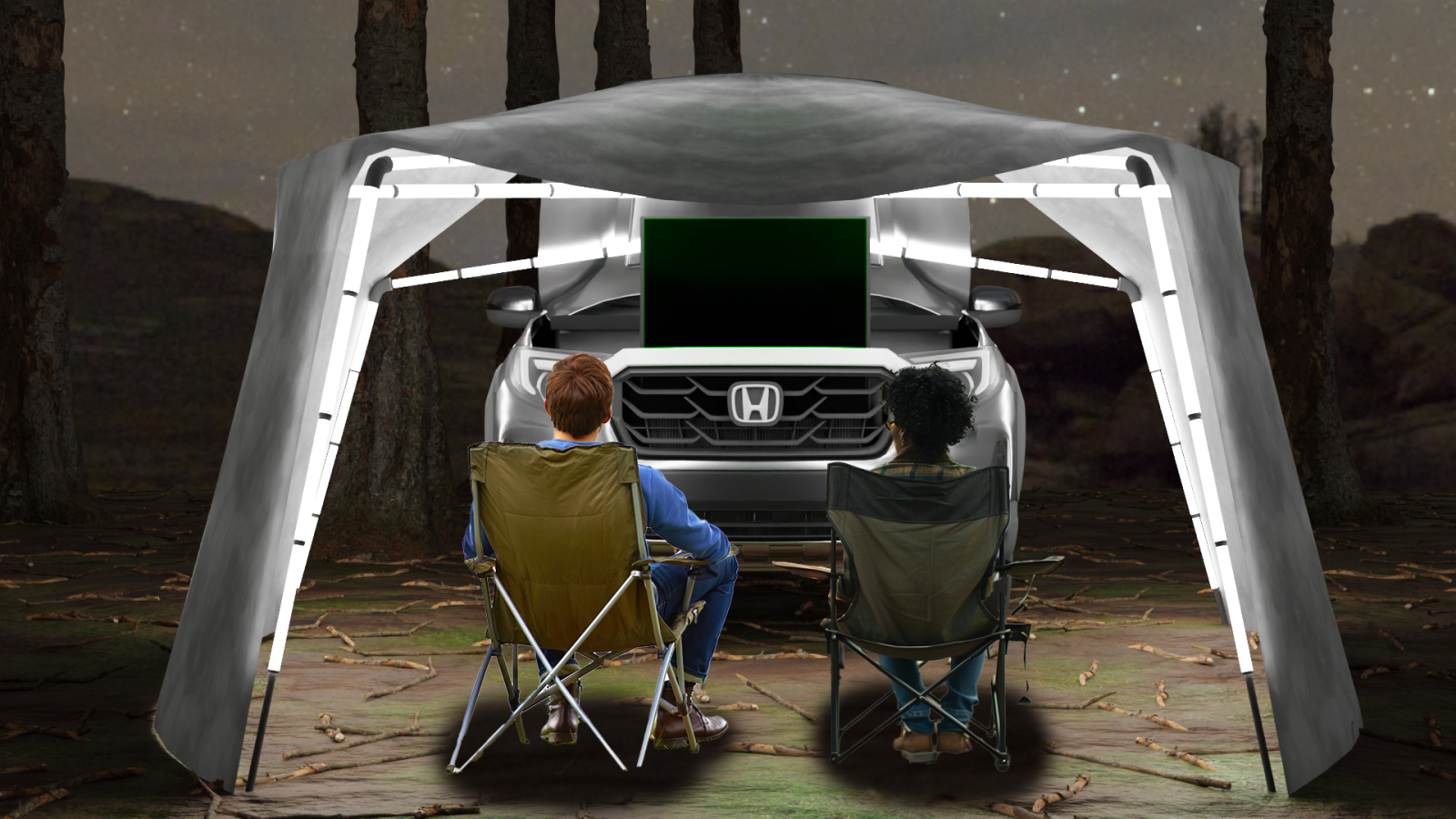 Two campers sit in foldable chairs under a lightweight, illuminated canopy extending from the frunk of a Honda EV at nighttime. A large screen is mounted inside the frunk, creating an outdoor movie setup.