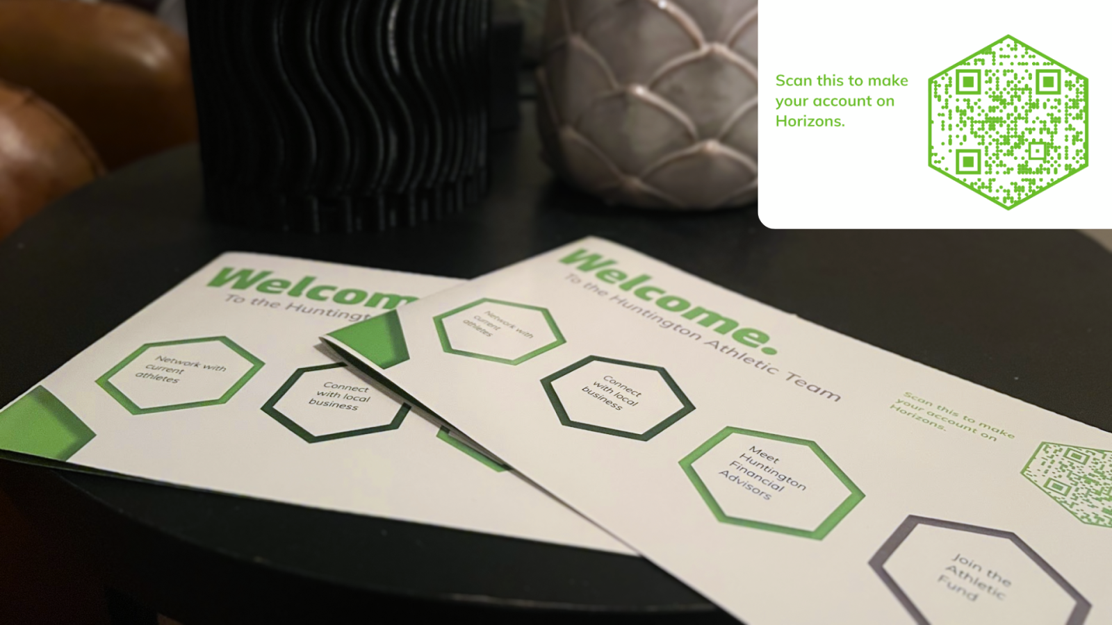 2.	Pamphlets on a tabletop displaying the various points of interest for a student athlete to join the Horizons program. In the corner is displayed a QR code which will direct you to the application. 