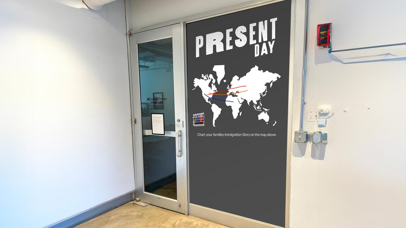This image displays the “Present-Day” wall located at the end of the end of the exhibition. This wall is an interactive wall that visitors can leave their mark on by plotting their family’s immigration journey using the markers provided.