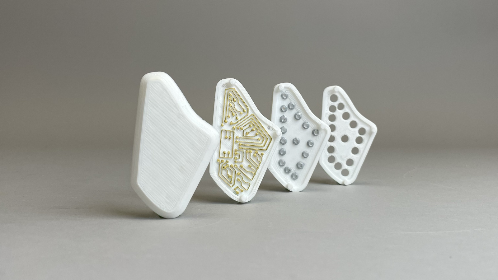 Photograph of 3D printed implant model with components displayed