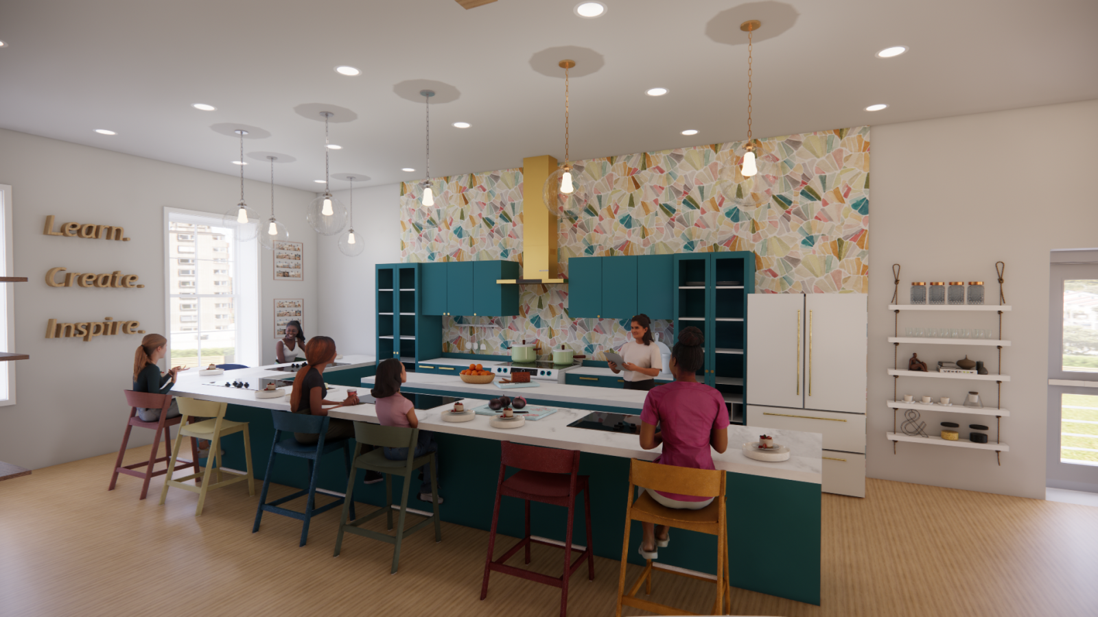 A modern, inviting kitchen and learning space featuring a large central island with seating for multiple participants, creating a collaborative and interactive environment. The color scheme includes deep teal cabinetry, a patterned backsplash with warm and pastel tones, and gold accents on the range hood and cabinet handles. Pendant lights hang above the island, adding to the cozy ambiance. On the left wall, wooden text reads "Learn. Create. Inspire.," reinforcing the room's purpose as a creative and educat