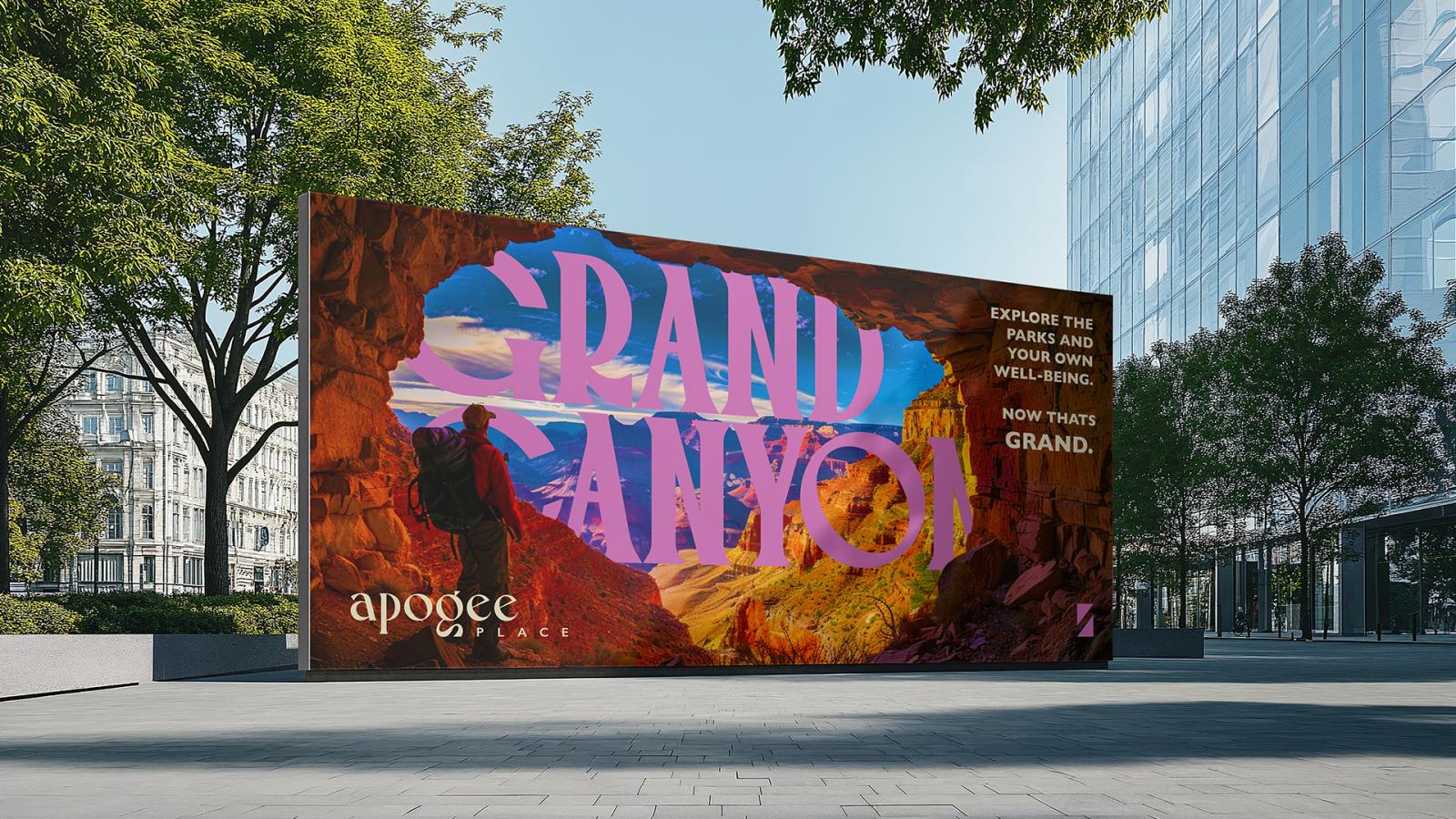 A billboard set in an urban area promoting Apogee Place at the Grand Canyon location 