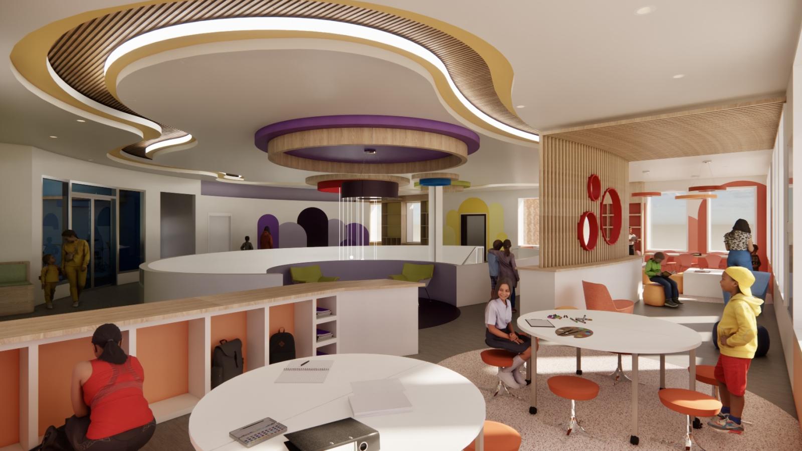 The workzone is a focused environment designed for educational activities, with orange walls and workstations for learning. The space encourages productivity and concentration.