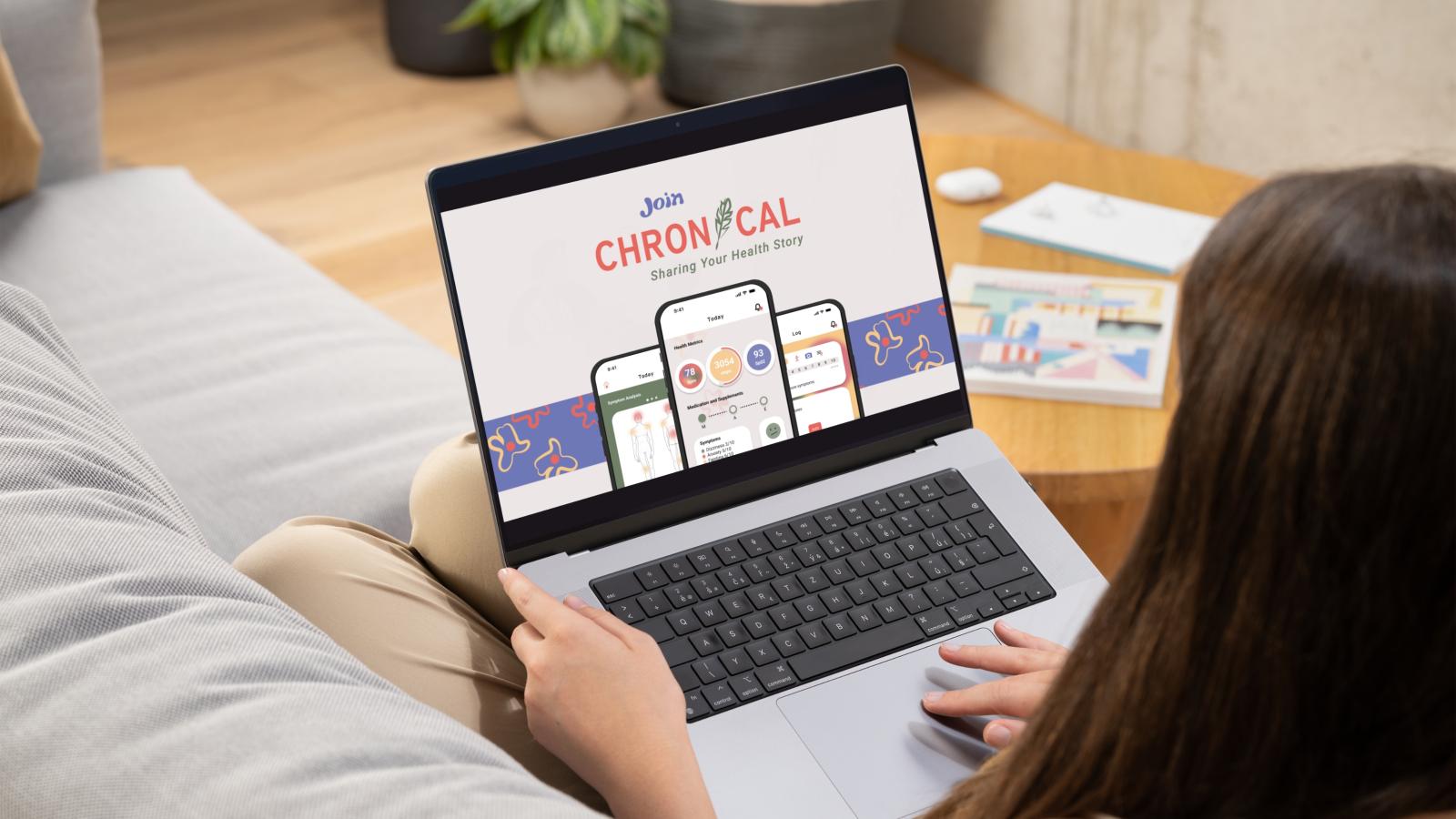 This image shows a middle aged woman with a laptop in her lap as she sits on a grey couch with a warm tones living room in the background. The screen of the computer shows a Chronical advertisement with three phone screens displaying Chronical’s home screen, symptom analysis screen, and symptom logging screen. The background is a light beige with a strip of rich blue pattered with yellow and pink flower illustrations. The image says, “Join Chronical” with the tagline “sharing your health story.”