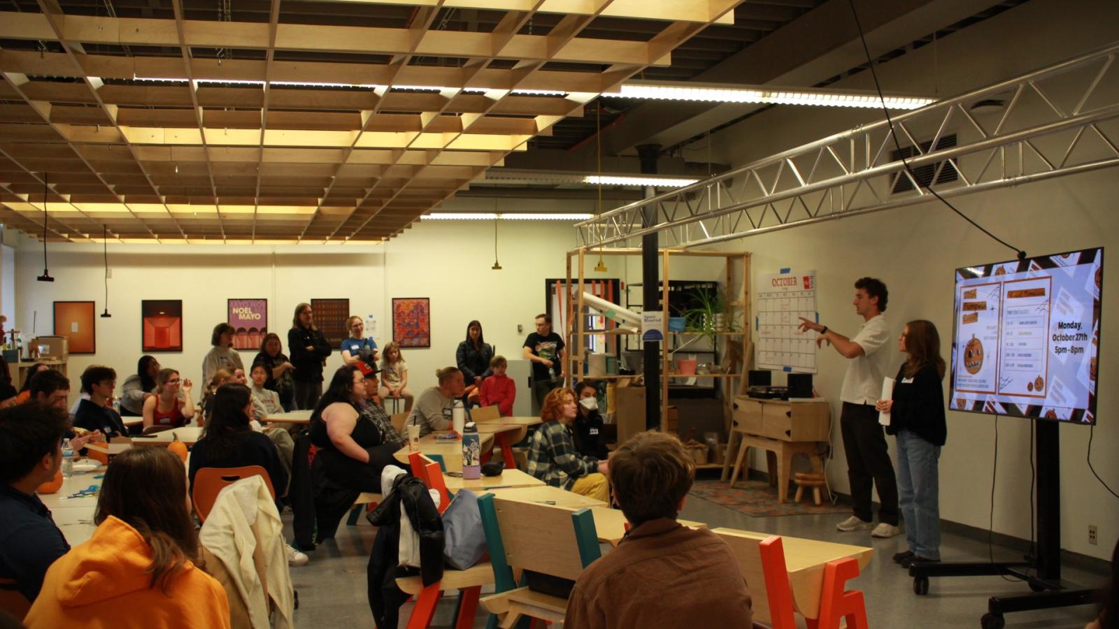 Photo of Anya and Will addressing the participants. 