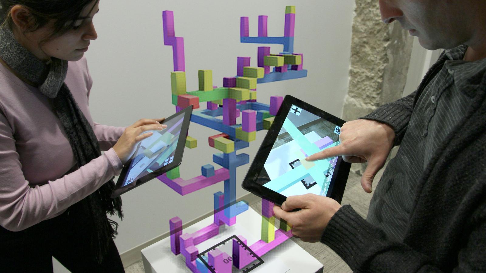 Graduate students interacting with Professor Price's ConstructAR app.
