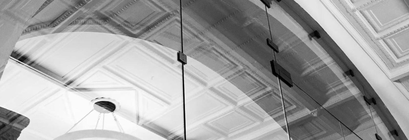 Black and White Photo of reflections in Hayes Lobby Entrance Glass